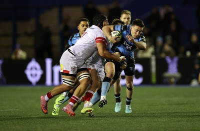 131225 - Cardiff Rugby v Ulster - United Rugby Championship - Josh Adams of Cardiff is tackled by Juarno Augustus of Ulster 