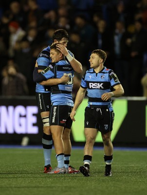 131225 - Cardiff Rugby v Ulster - United Rugby Championship - Callum Sheedy celebrates with Rory Thornton of Cardiff at full time