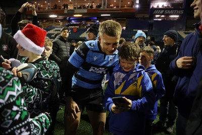 131225 - Cardiff Rugby v Ulster - United Rugby Championship - Cameron Winnett of Cardiff with fans at full time