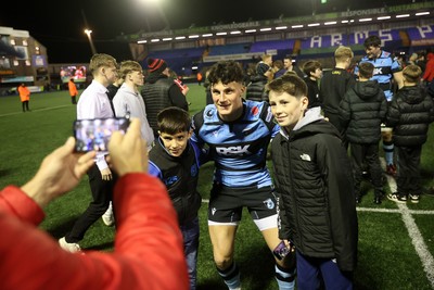 131225 - Cardiff Rugby v Ulster - United Rugby Championship - Ellis Bevan of Cardiff with fans at full time