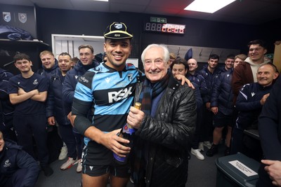 131225 - Cardiff Rugby v Ulster - United Rugby Championship - Ben Thomas of Cardiff receives his 100th cap from Sir Gareth Edwards