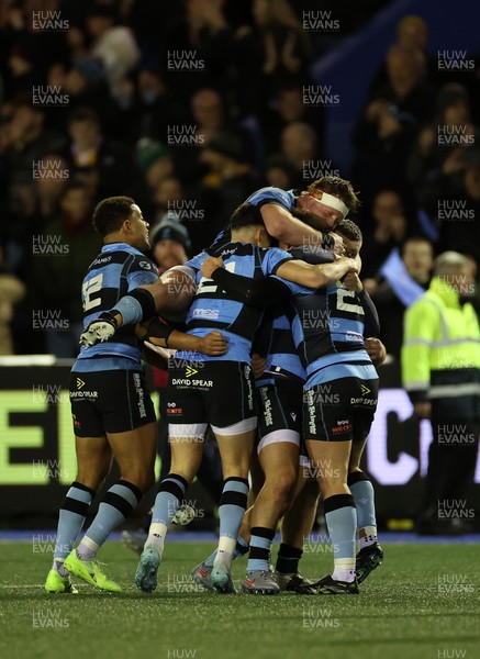 131225 - Cardiff Rugby v Ulster - United Rugby Championship - Callum Sheedy of Cardiff celebrates with teams mates after winning the game