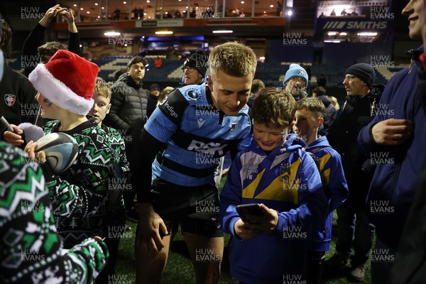 131225 - Cardiff Rugby v Ulster - United Rugby Championship - Cameron Winnett of Cardiff with fans at full time