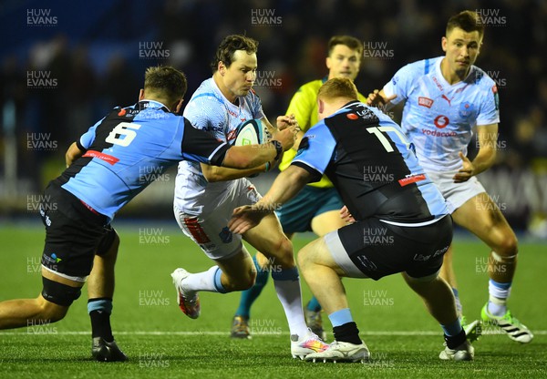 101123 - Cardiff Rugby v Vodacom Bulls - United Rugby Championship - Chris Smith of Bulls is tackled by Alex Mann and Rhys Carre of Cardiff