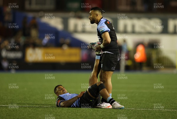 101123 - Cardiff Rugby v Vodacom Bulls - United Rugby Championship - Willis Halaholo helps out Rey Lee-Lo of Cardiff 