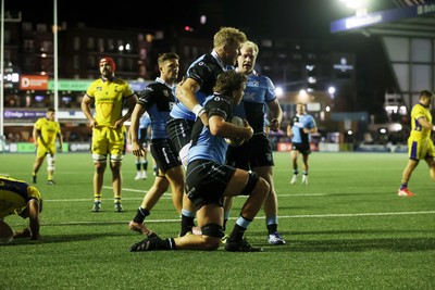 021026 - Cardiff Rugby v Zebre Parma - United Rugby Championship - Teddy Williams of Cardiff celebrates scoring a try with team mates