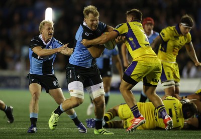 021026 - Cardiff Rugby v Zebre Parma - United Rugby Championship - Josh McNally of Cardiff is tackled by Federico Pisani of Zebre 