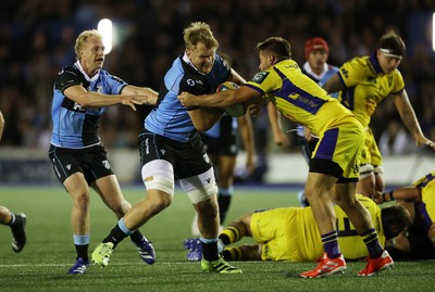 021026 - Cardiff Rugby v Zebre Parma - United Rugby Championship - Josh McNally of Cardiff is tackled by Federico Pisani of Zebre 
