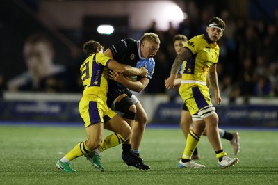 021026 - Cardiff Rugby v Zebre Parma - United Rugby Championship - Rhys Barratt of Cardiff is tackled by Giulio Bertaccini of Zebre 