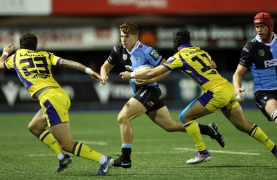 021026 - Cardiff Rugby v Zebre Parma - United Rugby Championship - Steffan Emanuel of Cardiff is tackled by Giacomo Da Re and Simone Gesi of Zebre 