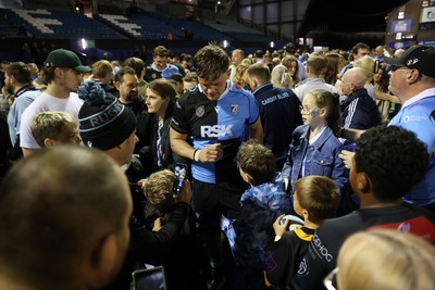 021026 - Cardiff Rugby v Zebre Parma - United Rugby Championship - Alex Mann of Cardiff with fans at full time