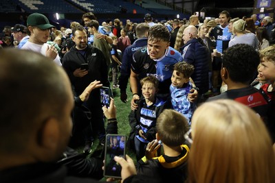 021026 - Cardiff Rugby v Zebre Parma - United Rugby Championship - Alex Mann of Cardiff with fans at full time