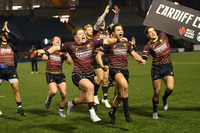 031225 - Cardiff Uni v Cardiff Met - Cardiff Clash - Cardiff Met players celebrate the win at full time