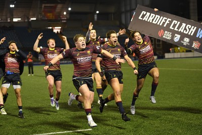 031225 - Cardiff Uni v Cardiff Met - Cardiff Clash - Cardiff Met players celebrate the win at full time