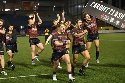 031225 - Cardiff Uni v Cardiff Met - Cardiff Clash - Cardiff Met players celebrate the win at full time