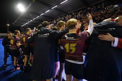 031225 - Cardiff Uni v Cardiff Met - Cardiff Clash - Cardiff Met players celebrate the win at full time