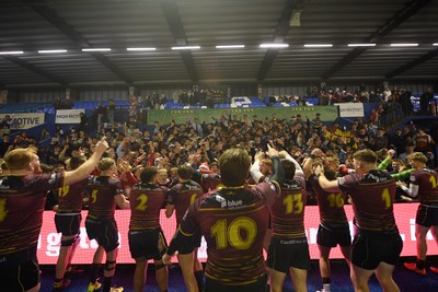 031225 - Cardiff Uni v Cardiff Met - Cardiff Clash - Cardiff Met players celebrate the win at full time with fans