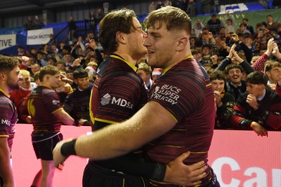 031225 - Cardiff Uni v Cardiff Met - Cardiff Clash - Cardiff Met players celebrate the win at full time