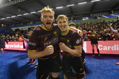 031225 - Cardiff Uni v Cardiff Met - Cardiff Clash - Cardiff Met players celebrate the win at full time