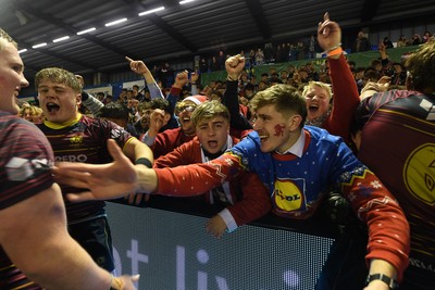 031225 - Cardiff Uni v Cardiff Met - Cardiff Clash - Cardiff Met players celebrate the win at full time with fans