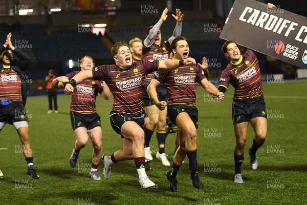 031225 - Cardiff Uni v Cardiff Met - Cardiff Clash - Cardiff Met players celebrate the win at full time