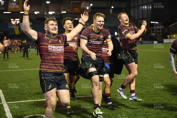 031225 - Cardiff Uni v Cardiff Met - Cardiff Clash - Cardiff Met players celebrate the win at full time