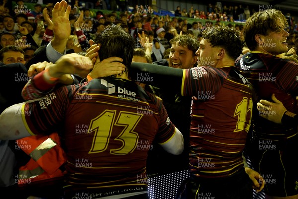 031225 - Cardiff Uni v Cardiff Met - Cardiff Clash - Cardiff Met players celebrate the win at full time