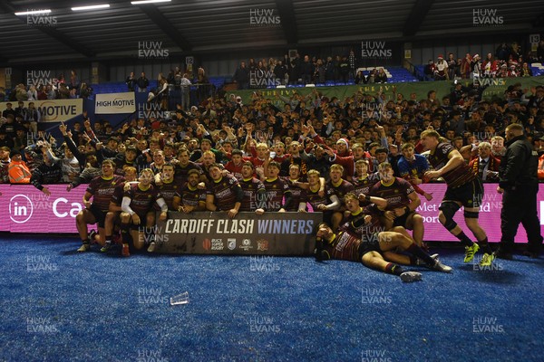 031225 - Cardiff Uni v Cardiff Met - Cardiff Clash - Cardiff Met players celebrate the win at full time