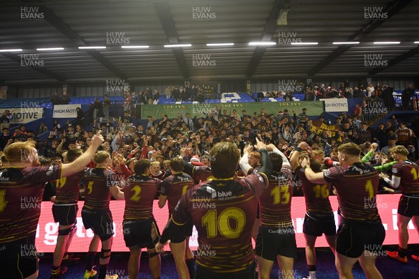 031225 - Cardiff Uni v Cardiff Met - Cardiff Clash - Cardiff Met players celebrate the win at full time with fans