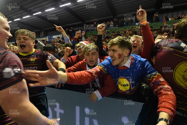 031225 - Cardiff Uni v Cardiff Met - Cardiff Clash - Cardiff Met players celebrate the win at full time with fans