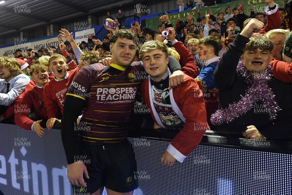 031225 - Cardiff Uni v Cardiff Met - Cardiff Clash - Cardiff Met players celebrate the win at full time with fans