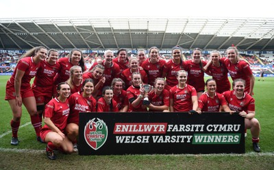 240424 - Cardiff University v Swansea University - Welsh Varsity Women’s Match - Cardiff University Celebrate after defeating Swansea University and lift the Welsh Varsity Cup