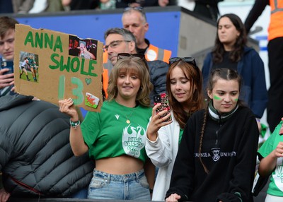 240424 - Cardiff University v Swansea University - Welsh Varsity Women’s Match - Supporters of Swansea Uni cheering on their team 