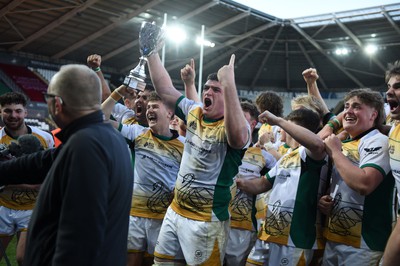 240424 - Cardiff University v Swansea University - Welsh Varsity Mens Match - Swansea University celebrate lifting the trophy after victory over Cardiff University