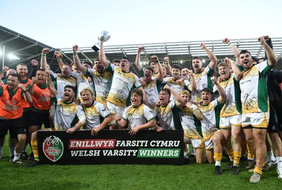 240424 - Cardiff University v Swansea University - Welsh Varsity Mens Match - Swansea University celebrate lifting the trophy after victory over Cardiff University