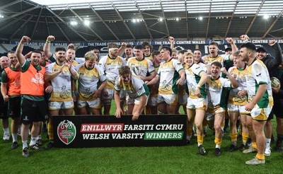 240424 - Cardiff University v Swansea University - Welsh Varsity Mens Match - Swansea University celebrate lifting the trophy after victory over Cardiff University