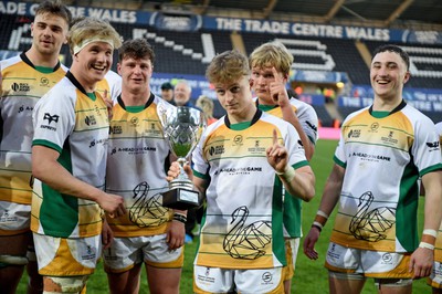 240424 - Cardiff University v Swansea University - Welsh Varsity Mens Match - Swansea University celebrate lifting the trophy after victory over Cardiff University