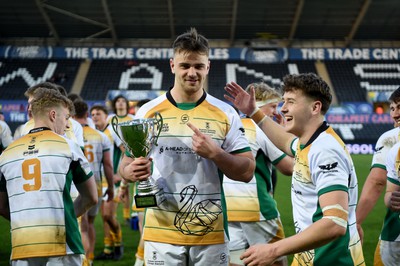 240424 - Cardiff University v Swansea University - Welsh Varsity Mens Match - Swansea University celebrate lifting the trophy after victory over Cardiff University