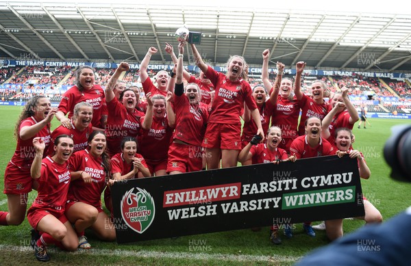 240424 - Cardiff University v Swansea University - Welsh Varsity Women’s Match - Cardiff University Celebrate after defeating Swansea University and lift the Welsh Varsity Cup