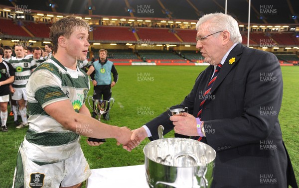 30.03.11 - Cardiff University v Swansea University - Welsh Varsity 2011 - Tom Rowlands of Swansea University receives the man of the match award from WRU President Dennis Gethin. 