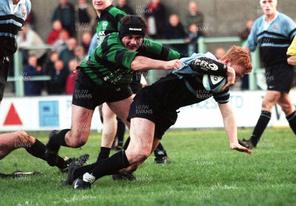 201297 - Cardiff RFC v Abercarn - Jamie Ringer of Cardiff beats Chesney Chick to score a try