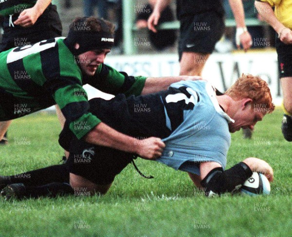 201297 - Cardiff RFC v Abercarn - Jamie Ringer of Cardiff beats Chesney Chick to score a try