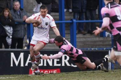 06.03.10 Cardiff RFC v Ayr RFC - British & Irish Cup -  Cardiff's Ryan Howells fends off Ayr's Andy Wilson. 