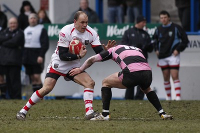 06.03.10 Cardiff RFC v Ayr RFC - British & Irish Cup -  Cardiff's Craig Morgan hands off Ayr's Ross Curle. 