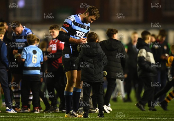 180223 - Cardiff Rugby v Benetton - United Rugby Championship - Max Llewellyn of Cardiff is greeted by supporters at the ene of the game
