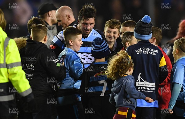 180223 - Cardiff Rugby v Benetton - United Rugby Championship - Brad Thyer of Cardiff is greeted by supporters at the ene of the game