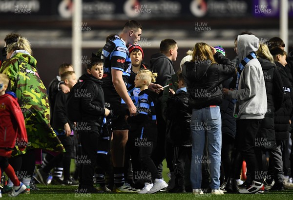 180223 - Cardiff Rugby v Benetton - United Rugby Championship - Seb Davies of Cardiff is greeted by supporters at the ene of the game
