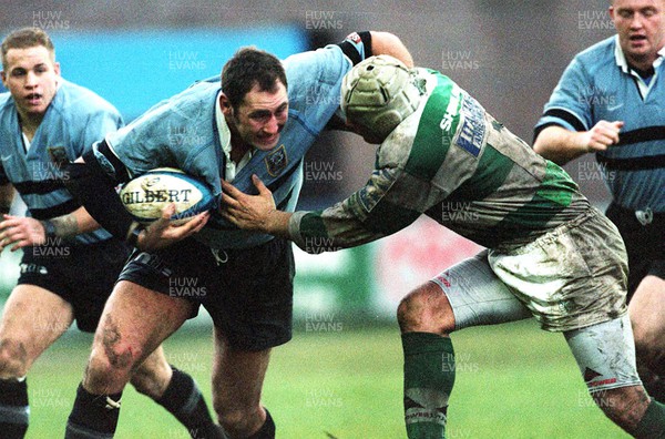 111299 - Cardiff v Benetton Treviso - Heineken Cup - Cardiff's Emyr Lewis takes on Andre Sgorlon