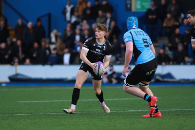 270124 - Cardiff v Bridgend - Indigo Group Premiership - Jamin Hodgkins of Bridgend Ravens looks to spread the ball wide