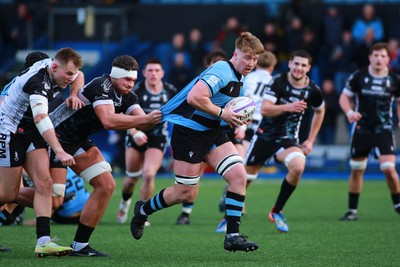 270124 - Cardiff v Bridgend - Indigo Group Premiership - Nathan Hudd of Cardiff is tackled by Dylan Burrows of Bridgend Ravens 